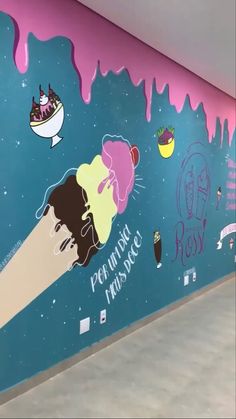 an ice cream parlor wall painted in pink and blue