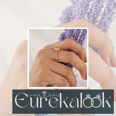 a woman's hand holding a ring with the words gure kalook on it