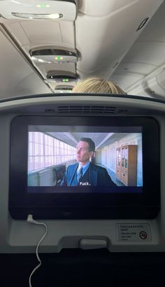 a television screen on the back of an airplane