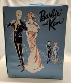 an old fashion lunch box with the image of a man and woman in formal attire