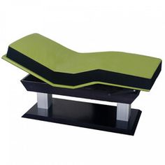 a green and black bench cushion sitting on top of a stand