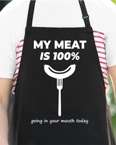 a man wearing an apron that says, my meat is 100 % going in your mouth today