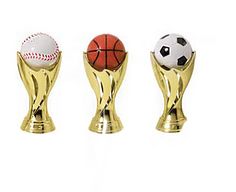 three trophies with balls in them on a white background