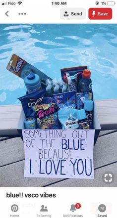 a box filled with items next to a swimming pool that says something out of the blue because i love you