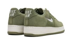 The Nike Air Force 1 Low "Color Of The Month - Oil Green" is a colorway of the retro basketball shoe from the “Color of the Month” collection that was originally started by Baltimore sneaker stores in 1984.  By ordering the Air Force 1 in an assortment of colorways from Nike, Baltimore sneaker shops helped save the shoe from being discontinued.  The “Color of the Month” collection in the present day honors and revives the look of the Air Force 1s from the throwback line.  The “Oil Green” features an Oil Green suede construction with tonal overlays.  A milky jeweled Swoosh appears on either side of the shoe.  The “Nike Air” branding on the heel is reminiscent of the styling found on the original AF1 from the early-to-mid 1980s.  Release date: June 6, 2023 Green Air Force, Color Of The Month, Retro Basketball Shoes, Retro Basketball, Air Force 1s, Sneaker Stores, Air Force One, Force One, Stadium Goods