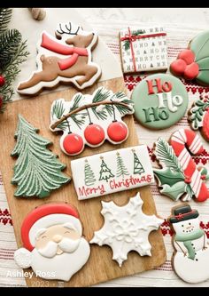 decorated christmas cookies on a cutting board