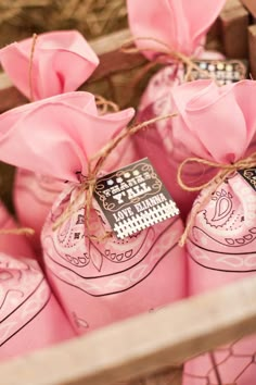 pink shoes are wrapped in twine and tied with string to give them as favors