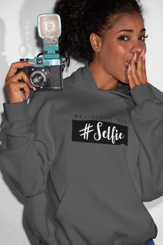 Selfie Hoodie Unisex Hoodie A cozy, no-nonsense hoodie to keep you warm. Air jet yarn for a soft, pill-resistant finish with two-ply hood. Front Pouch Pocket.  Material: 50/50 cotton/poly fleece.  Size (Unisex): S – 18” Chest M – 20” Chest L – 21” Chest XL – 23” Chest 2XL – 24” Chest 3XL – 26” Chest 4XL – 28” Chest 5XL – 30” Chest  >> Made in the USA Selfie Hoodie, Hoodie Selfie, Quarter Zip, Athletic Jacket