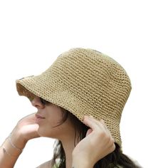 This hat is 100% handmade and crafted from raffia yarn. Raffia yarn is a natural and durable material, ensuring the hat's longevity. The wide brim of the hat is perfect for sun protection and offers a stylish look. This beige hat stands out with its simple and elegant design. It is an excellent accessory for both everyday use and outdoor activities like the beach. Its comfortable and lightweight structure ensures easy and prolonged wear. Raffia. You can store this hat, knitted from raffia rope, in a breathable cloth bag, protect it from fire and heat, and wipe the stains with a clean damp cloth. Wide Brim Crochet Hat Made Of Yarn, Beige Brimmed Crochet Hat For Warm Weather, Yarn Sun Hat With Curved Brim, Natural Crochet Hat With Curved Brim, Natural Curved Brim Crochet Hat, Natural Woven Wide Brim Bucket Hat, Wide Brim Natural Woven Bucket Hat, Wide Brim Woven Bucket Hat In Natural, Natural Wide Brim Toquilla Straw Bucket Hat