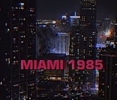 the city skyline is lit up in red and white with the word miami on it