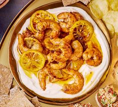 a plate full of shrimp and chips on a table