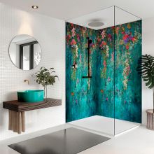 a bathroom with a shower, sink and mirror next to a potted plant on the counter