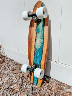 a skateboard is leaning against the wall with its wheels on it's side