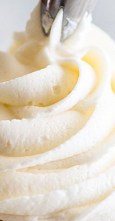 a close up view of whipped cream and bananas