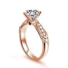 a rose gold engagement ring with diamonds on the side