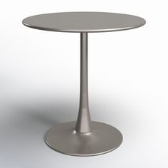 a round table with a metal base on an isolated white background for use in commercial projects