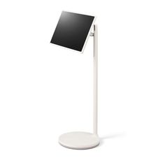 a white desk lamp with a black screen on it's side and a round base