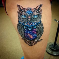 an owl tattoo is shown on the thigh