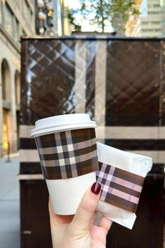 a hand holding a Burberry branded coffee cup Statement Wall, The Weekend, New Product