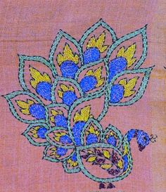 an embroidered cloth with blue and yellow flowers on it, in the shape of a peacock