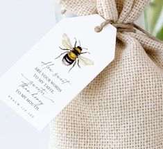 a bag with a bee on it and a tag that says, save the bees