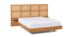 a bed with a wooden headboard and foot board on it's side, in front of a white background