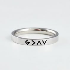 "This listing is for one stainless steel band ring, engraved with the symbols combination of \"God is greater than the highs and lows\". It makes a great encouragement gift for friends, sisters in Christ or yourself.  Materials & Features: This ring is made of high quality hand polished solid stainless steel, which is hypoallergenic (good for metal-sensitive skin). Stainless steel will not tarnish, its luster and durability will make it last for many years. The black text on the ring will not fa Christian Accessories, Stamped Rings, Friends Christmas, Encouragement Gifts, Stacking Bands, Bracelet Crafts, Religious Jewelry