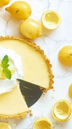 a lemon tart with whipped cream and sliced lemons