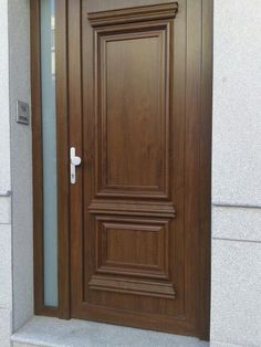 a wooden door with glass on the outside