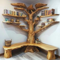 a wooden bench sitting under a tree with bookshelves on it's sides