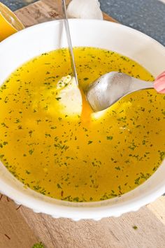 a spoon in a bowl filled with soup