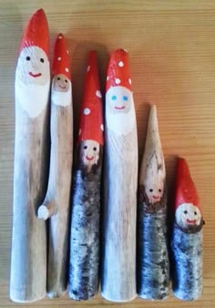 several wooden sticks with painted faces and noses