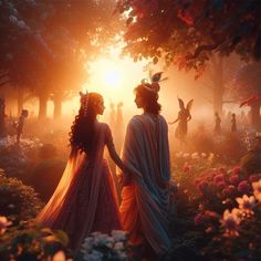 two women standing in the middle of a forest at sunset