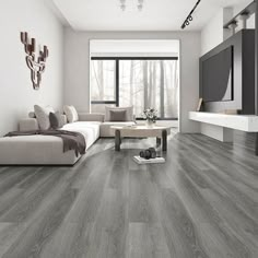 a modern living room with wood flooring and white furniture in grey tones, along with a large window