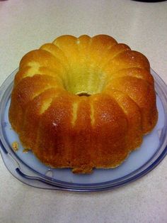 the most amazing lemon cake ever on a plate with an advertise above it