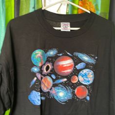 a t - shirt with an image of the planets on it