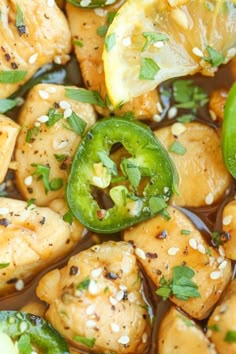 chicken and pineapple stir - fry with sesame seeds, green peppers, and sliced jalapenos