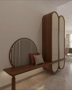 a wooden bench sitting next to a wall with mirrors on it's back end