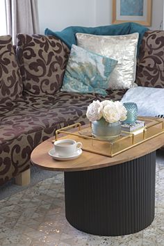 a living room filled with furniture and a coffee table