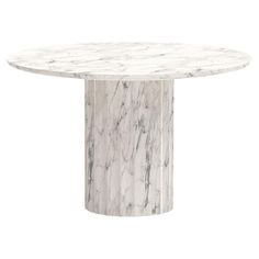 a white marble dining table with an oval base