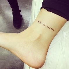 a woman's foot with the words made in brasil written on her left ankle