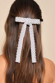 The Lulus Exemplary Sweetness White Pearl Beaded Bow Hair Clip is guaranteed to bring an undeniable charm to any of your fave looks! Sleek satin and sheer mesh come together to shape this delicate hair accessory with a bow silhouette adorned with gleaming faux pearls and dainty silver beads that create a mesmerizing design throughout. A silver barrette clip closure will effortlessly secure your tresses to ensure the best hair day ever! 5. 25" Wide And 7. 5" Long. 80% Acrylic, 20% Alloy. Imported Bow Silhouette, Embroidered Hair Bows, Pageant Hair, Beaded Bow, Bow Hair Clip, Sleek Hairstyles, Good Hair Day, Formal Hairstyles, Bow Hair