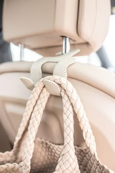 the interior of a car with braided seatbelts and steering wheel covers on it