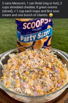 an image of a bowl of food that is on top of a wooden table with the words scoop party sizzle