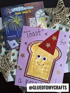 a close up of a greeting card with a toast on it and fireworks in the background