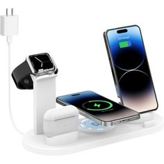 an apple watch and charging station with two devices connected to each other on a white surface