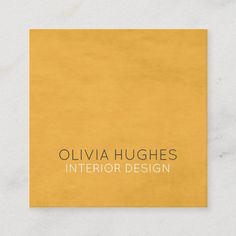 a yellow business card with the words olvia hughes interior design on it