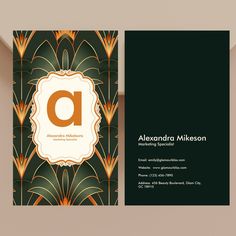 a business card with an art deco design on the front and back, along with a black background