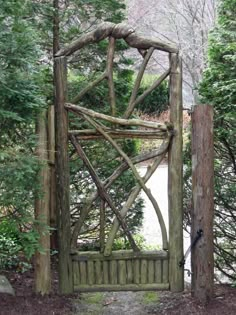 an old wooden gate in the woods