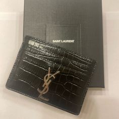 Ysl Black Croc 5 Card Holder With Dust Bag, Box, And Original Tag Minor Wear At Bottom Corners 2 Front/ 2 Back/ 1 Middle Card Slots Ysl Cardholder, Ysl Star Card Holder, Luxury Designer Black Card Holder, Black Ysl Wallet, Ysl Wallet On Chain, Yves Saint Laurent Bags, Card Slots, Yves Saint Laurent, Dust Bag